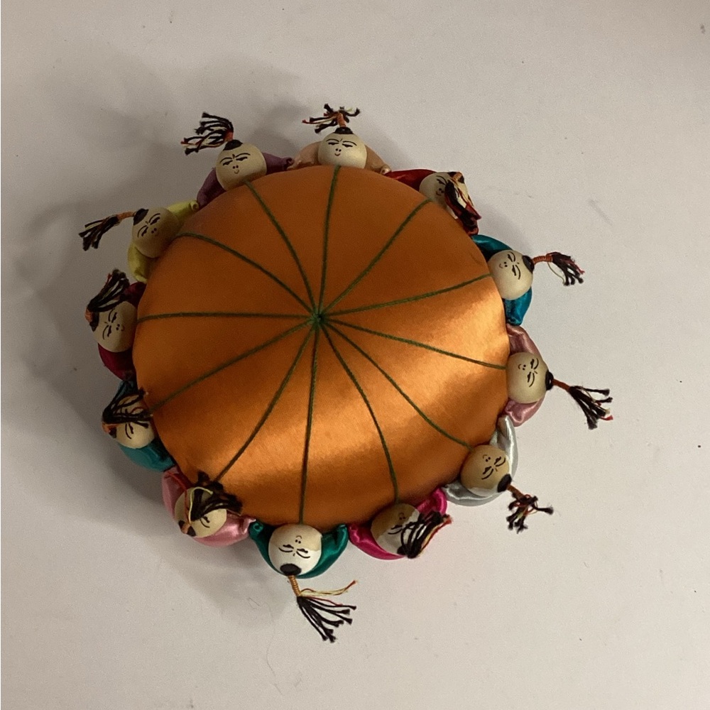 Orange Decorative Pin Cushion with Asian Doll Accents